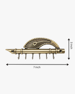 Product dimensions for the antique flute key holder, measuring 7 inches in length and 3 inches in height