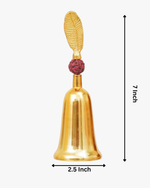 Gold-plated decorative bell with a red rudraksha bead and a leaf-shaped handle on top