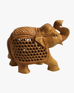 Traditional hand carved wooden elephant statue with detailed lattice design