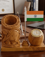 Wooden elephant carved desk organizer with Indian flag placed on an executive office table