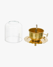 Sacred Akhand Jyot brass oil lamp with a steady flame inside a glass cover, symbolizing devotion and spiritual light