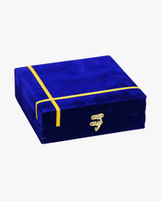 Blue velvet pooja thali set gift box with golden ribbon and metal lock closed view