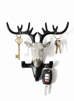 Decorative deer head wall mounted key holder with antler hooks holding house keys and car key remote