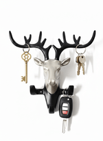 Modern deer head wall key holder with antlers holding keys and car remote, stylish home decor hook