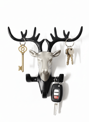 Modern deer head wall key holder with antlers holding keys and car remote, stylish home decor hook