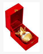 Gold plated kalash neatly placed inside a premium red velvet gift box for festive gifting