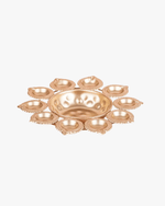 Golden brass urli diya stand for festive decoration and pooja setup
