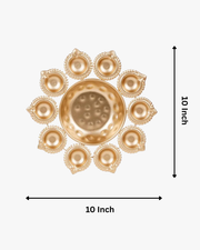 A circular arrangement of glowing golden diyas surrounding a bowl filled with red rose petals and a central candle, creating a warm festive decoration for Diwali. 🪔🌹✨