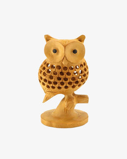 Hand-carved wooden owl figurine with detailed feather carving, perched on a small branch stand, natural wood finish decorative sculpture. 🦉
