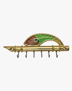 Handcrafted brass flute key holder with peacock feather design and 6 hooks for wall-mounted home organization