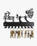 Black metal Hare Krishna key holder for wall with 7 hooks holding multiple sets of keys