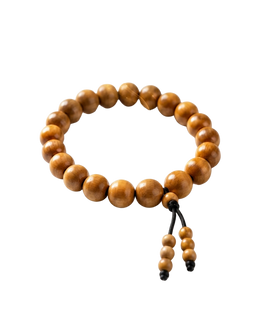 Handcrafted golden brown wooden bead bracelet with a traditional adjustable black string knot isolated on a solid black background