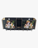 Radha Krishna wooden wall key holder with mobile stand, pen holder, and multiple hooks for organizing keys and daily essentials.
