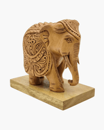 Royal hand carved wooden elephant showpiece with trunk detailed front angle view