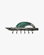 Front view of a polished silver flute-style key holder featuring an ornate green and blue peacock feather accent and six sturdy hooks