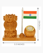 Product dimensions diagram showing 5.5 inches length and 4.5 inches height for wooden Ashok Stambha pen stand with clock and flag.