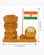 Product dimensions diagram showing 5.5 inches length and 4.5 inches height for wooden Ashok Stambha pen stand with clock and flag.