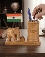 Wooden elephant desk organizer pen stand filled with pens and featuring Indian tricolor flag