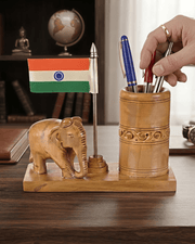Wooden elephant desk organizer pen stand filled with pens and featuring Indian tricolor flag