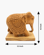 Dimension chart showing 5.5 inch length and 4.5 inch height of handcrafted wooden elephant