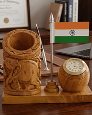 Wooden elephant carved desk organizer with Indian flag placed on an executive office table