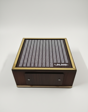 Angled view of wooden ₹1 lakh savings challenge money bank